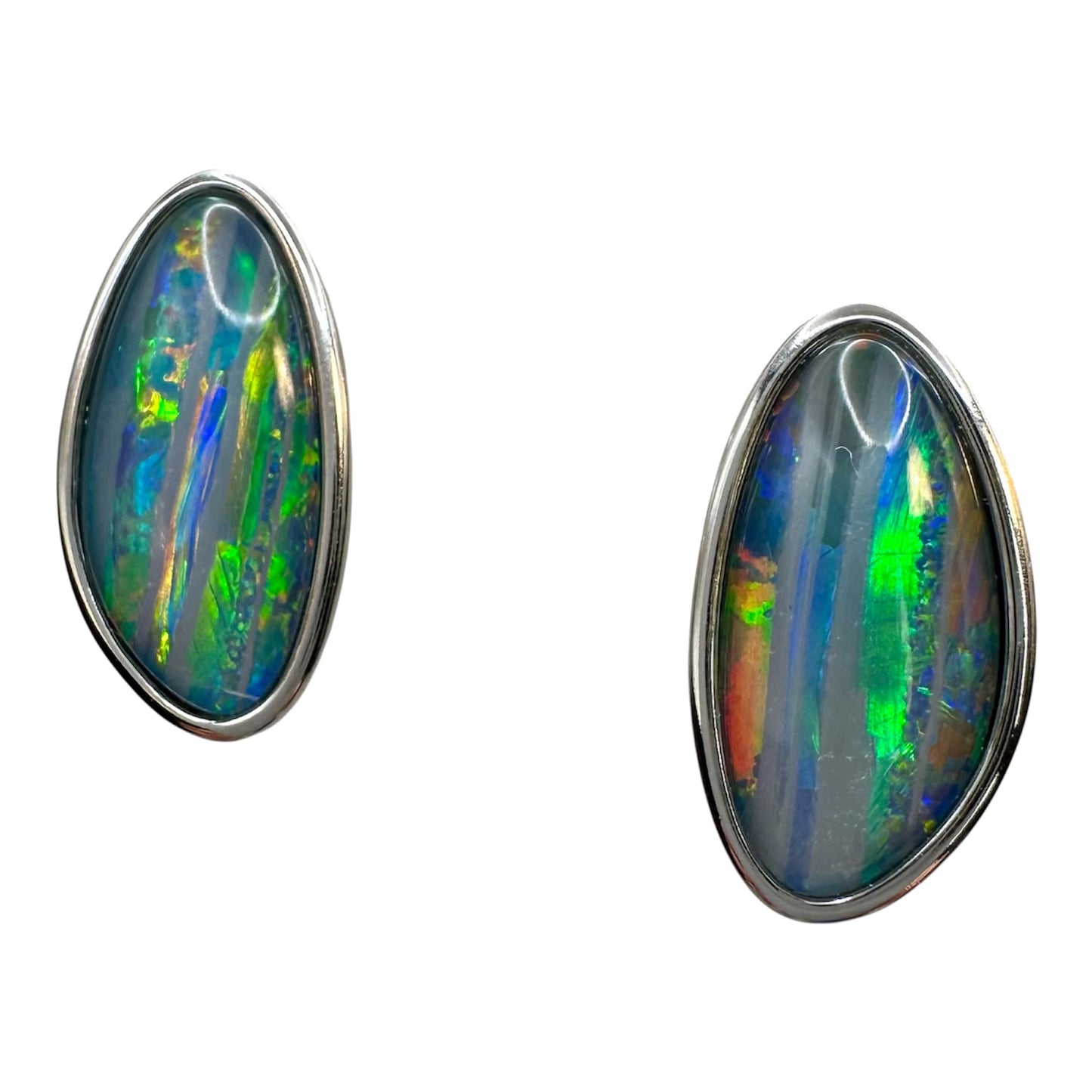 Pair of opal earrings with silver setting on a white background