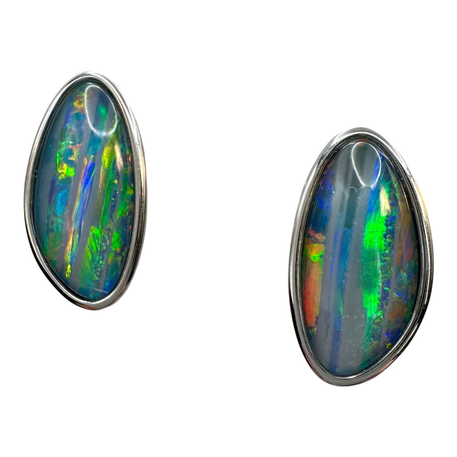 Pair of opal earrings with silver setting on a white background